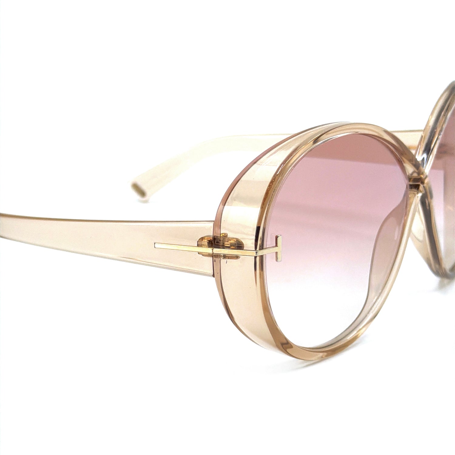 Side view of Tom Ford TF1116 45T Edie-02 sunglasses in transparent light brown, highlighting the bold acetate temples and premium Italian craftsmanship