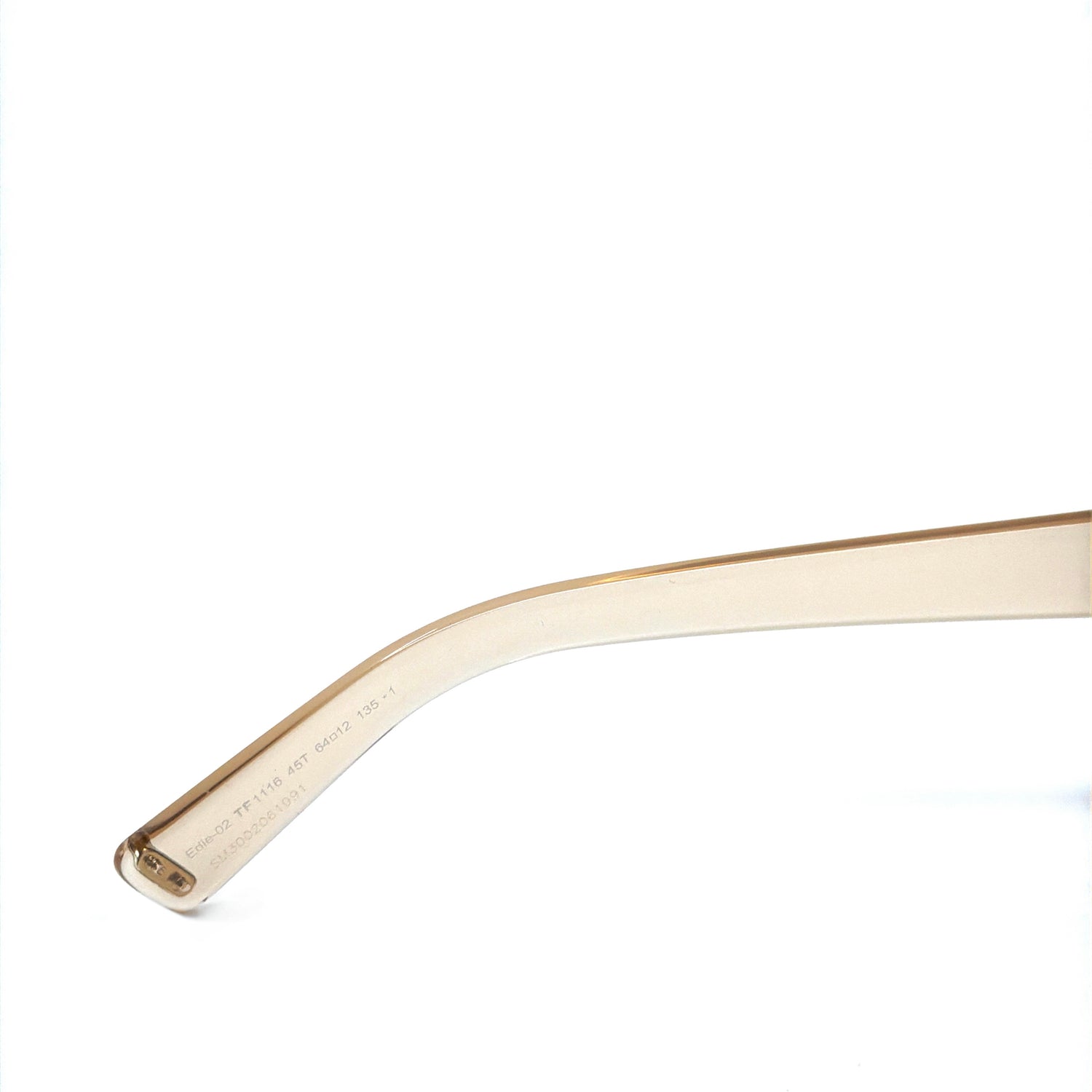 Detailed view of the Tom Ford Edie-02 TF1116 45T sunglasses hinge and transparent light brown frame, highlighting premium acetate quality and 100% UV protection lenses